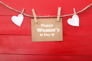 Wall Mural - Women's day message with felt hearts hanging with clothespins