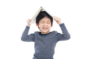 Canvas Print - Asian boy with book on head