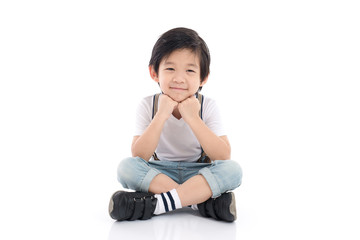 Wall Mural - asian boy sitting on white background