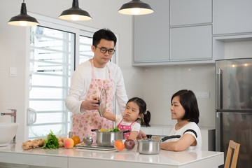 Wall Mural - asian family cooking at kitchen