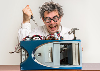 Crazy engineer or scientist repairing computer