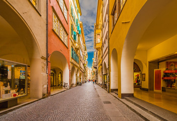 Wall Mural - People going shopping in the streets of Bolzano