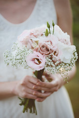 Wall Mural - Beautiful wedding bouquet in hands of the bride