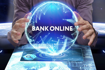 Business, Technology, Internet and network concept. Young businessman shows the word on the virtual display of the future: Bank online