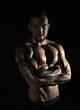 © Prostock-studio - Strong athletic man showes naked muscular body