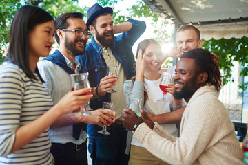 Poster - Intercultural buddies with drinks enjoying celebration