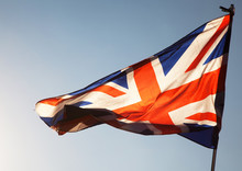 Close Up Of Union Jack Flag Against Blue Sky, UK