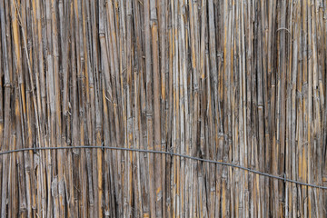  background of an old battered reeds, tied up wire