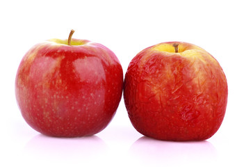 Ripe and rotten apple on a white background