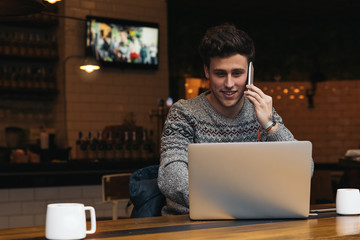 Businessman using his laptop in the Coffee Shop.