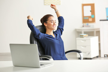 Poster - Beautiful young woman resting after work in office