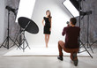© Africa Studio - Photographer working with model in studio