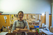 woman luthier small business owner portrait, in her musical instrument workshop