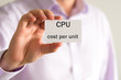 © stanciuc - Businessman holding a card with text CPU COST PER UNIT