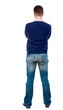 © ghoststone - Back view of man in jeans. Standing young guy. Rear view people collection.  backside view of person.  Isolated over white background. Man in jeans and a blue sweater standing with his arms crossed