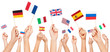 Hands holding flags of USA and EU member-states