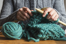 Woman Knitting Green Woolen Scarf
