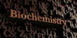 biochemistry - Wooden 3D rendered letters/message.  Can be used for an online banner ad or a print postcard.