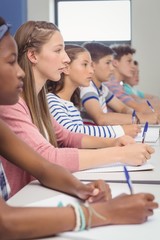 Wall Mural - Students studying in classroom