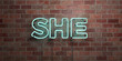 SHE - fluorescent Neon tube Sign on brickwork - Front view - 3D rendered royalty free stock picture. Can be used for online banner ads and direct mailers..