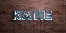 KATIE - Fluorescent Neon Tube Sign On Brickwork - Front View - 3D Rendered Royalty Free Stock Picture. Can Be Used For Online Banner Ads And Direct Mailers..