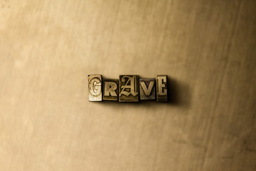 GRAVE - close-up of grungy vintage typeset word on metal backdrop. Royalty free stock illustration.  Can be used for online banner ads and direct mail.