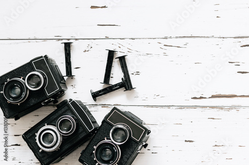 Stampa su Tela collection old vintage retro photo cameras on white wooden background