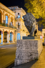 Wall Mural - Night scene in Old Havana with a famous bronze lion considered a symbol of the city