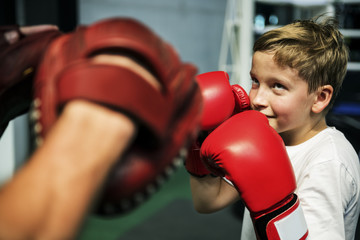 Boy Boxing Training Punch Mitts Exercise Concept