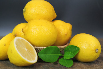 Wall Mural - fresh lemon whole and slice with lemon leaf