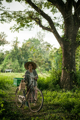 Wall Mural - Grandmother on bikes at the country side