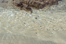 Shallow Sea Water With Pebbles