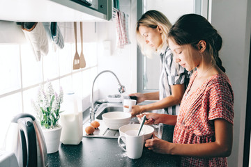 child baking with mom