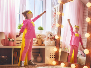 Wall Mural - child plays superhero