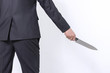 © thanatphoto - man hands with knife on a white background. / Young businessman working