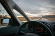 © vpilkauskas - The view through car windscreen. Driving during sunset on the country road.