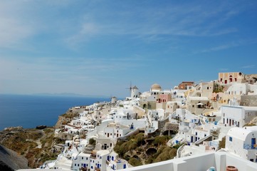 Wall Mural - Santorini - the volcano among the Cyclades, Aegean sea. Island's capital, Fira, which is situated on the edge of a cliff. Known for distinctive architecture in white and blue colours