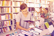 © JackF - Portrait of cheerful boy looking at open book