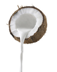 Wall Mural - coconut milk pouring side view isolated on white background
