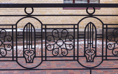 iron gate with wrought ornament on it