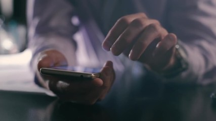 closeup of busines man hand using smartphone