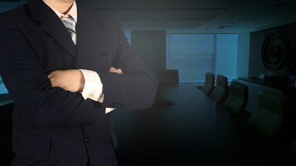 Confident Asian businessman arms crossed and stand up in meeting room.