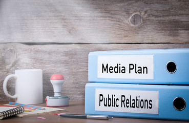 Canvas Print - public relations and media plan. two binders on desk in the office. business background.