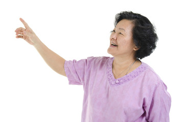 Wall Mural - Senior adult woman finger pointing