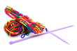 © Gary Perkin - Bright multi-colored colourful knitting wool or yarn with knitting needles on white background