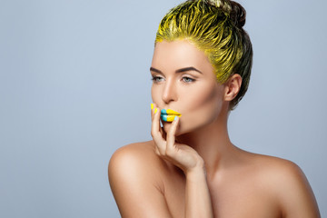 Canvas Print - Beautiful woman with yellow hair and colorful nails and lips