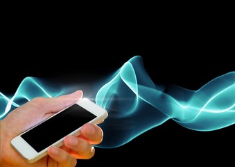 Wall Mural - composite image of hand holding cell phone against smoke effects