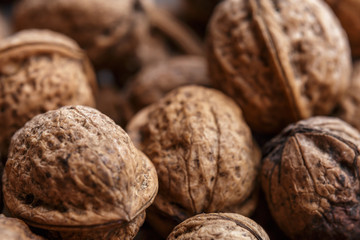 Wall Mural - Background of group close walnuts. Close-up or macro photo. 