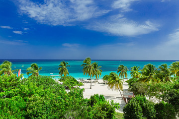 Stunning gorgeous beautiful, amazing view of Holguin province tropical inviting beach and tranquil azure turquoise ocean on blue sky background 