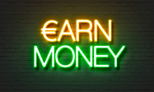 Earn Money Neon Sign On Brick Wall Background.